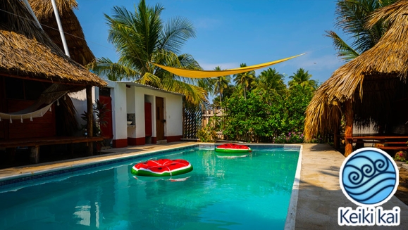 [Image: ¡Escapada Perfecta a la Playa! ¡Paga Q365 en Lugar de Q850 por 1 Noche para 2 Personas en Cabaña Tipo Hawaii con Baño Privado o Habitaciones Dobles con Baño Privado + Snacks de Desayuno + Uso de Instalaciones: Piscina, Hamacas y Más!m]