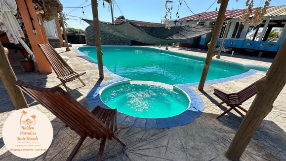 [Image: ¡Descubre un Paraíso Tropical en Playa Barra del Jiote! ¡Paga Q699 en Vez de Q1,400 por Estadía Para 2 Personas en Habitación Doble con AC + Piscinas + Jacuzzis + Playa + Traslado Exclusivo en Lancha con Recorrido Panorámico entre Manglares y Más!m]