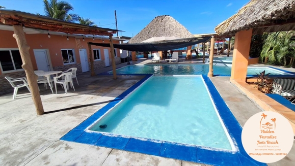 [Image: ¡Descubre un Paraíso Tropical en Playa Barra del Jiote! ¡Paga Q699 en Vez de Q1,400 por Estadía Para 2 Personas en Habitación Doble con AC + Piscinas + Jacuzzis + Playa + Traslado Exclusivo en Lancha con Recorrido Panorámico entre Manglares y Más!m]